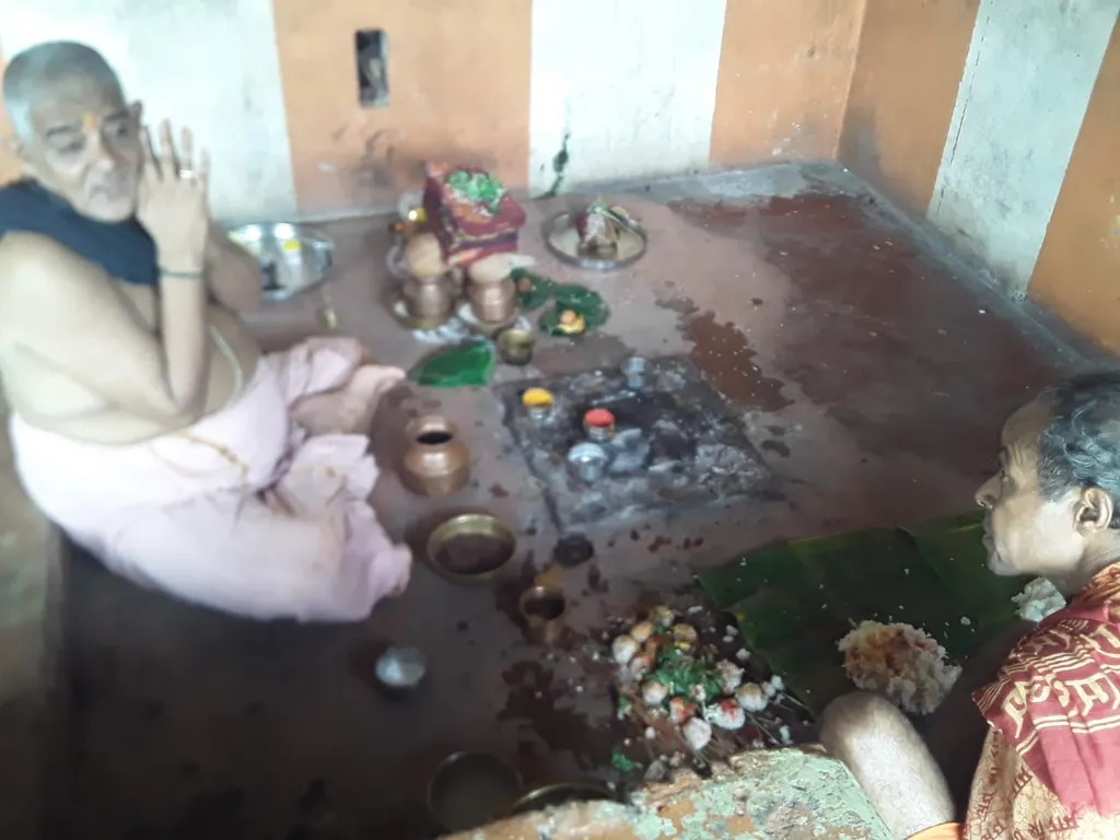 Shraddha and tarpana ritual being performed by priests at Gokarna, Karnataka